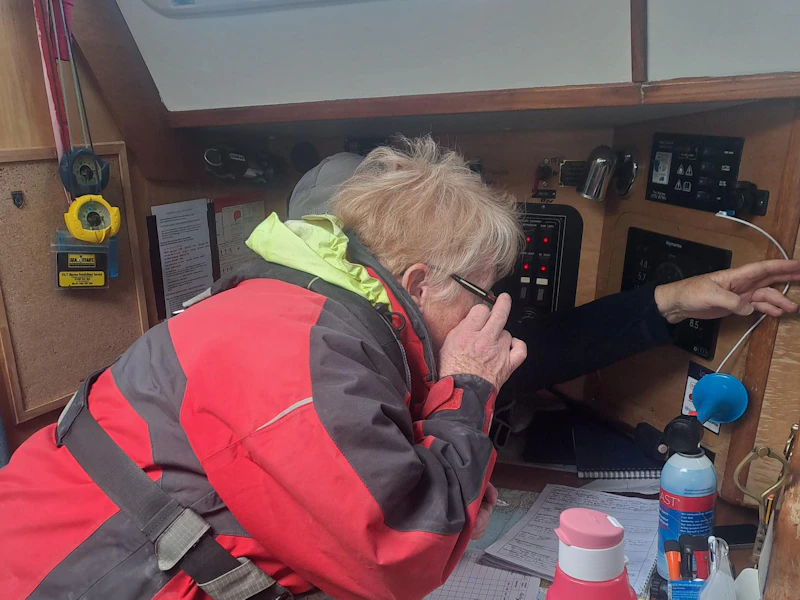 AdventureMind Grant 2025 Person using a boat radio.