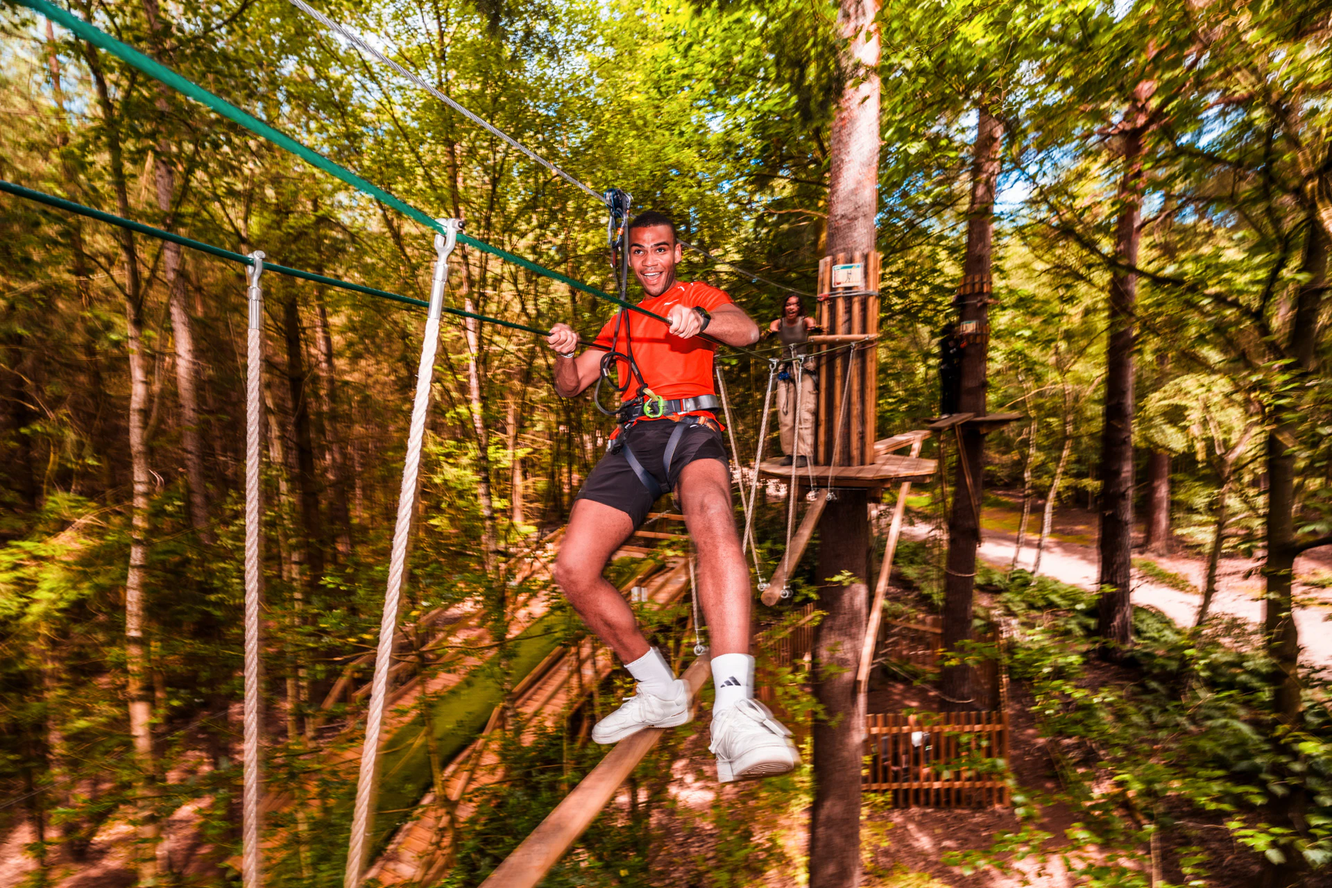 Person on a high ropes course.