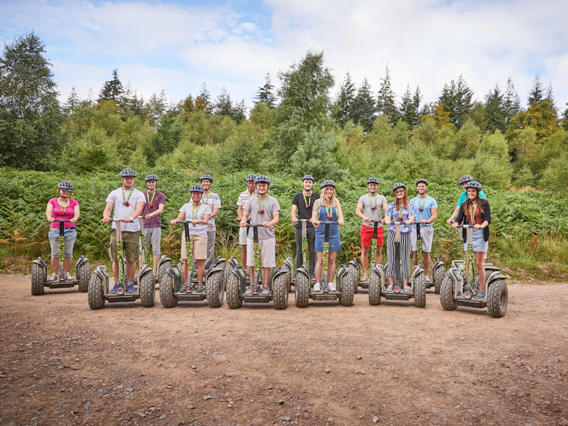Forest Segways group A groups of people stop for a photo in the forest during their Segway experience