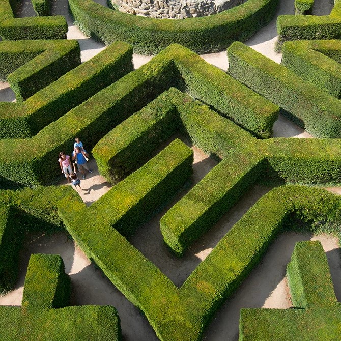 Looking down as people exploring the Leeds Caslte maze on a day out in Kent