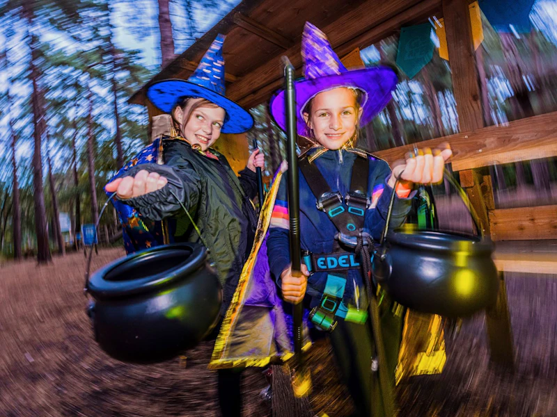 Two girls visit Go Ape dressed as halloween witches