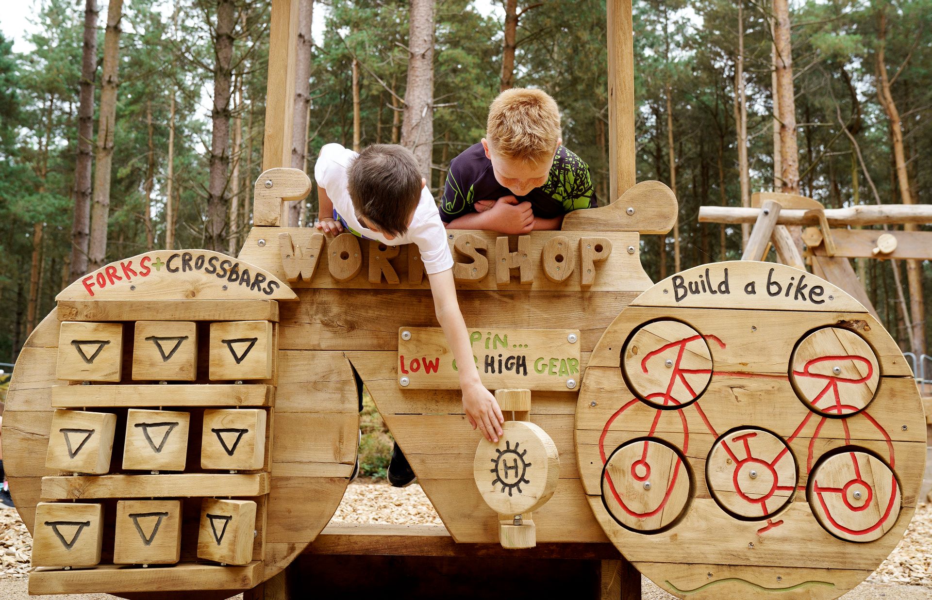 Young children explore play equipment at Cannock Chase