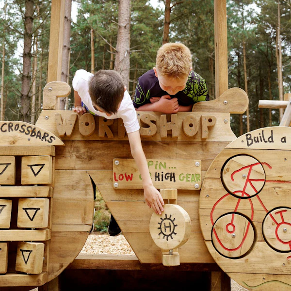 Young children explore play equipment at Cannock Chase