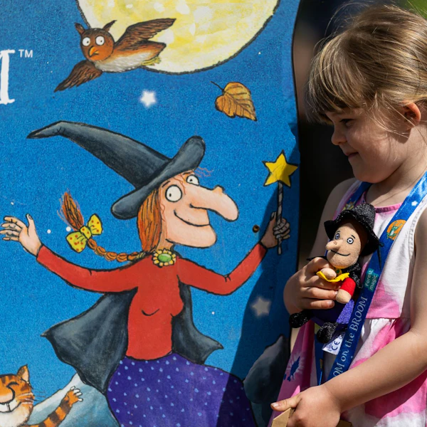 A small girl by a Room ont he Broom trail sign