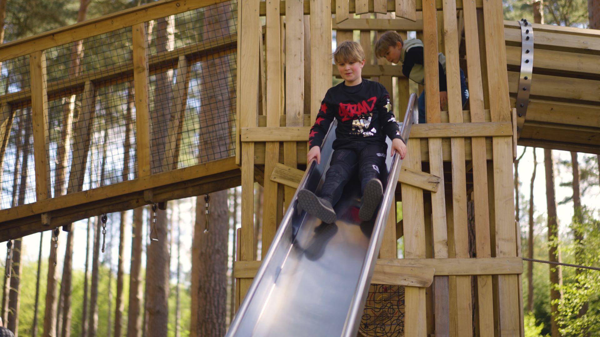 A child rides a slide in the playground