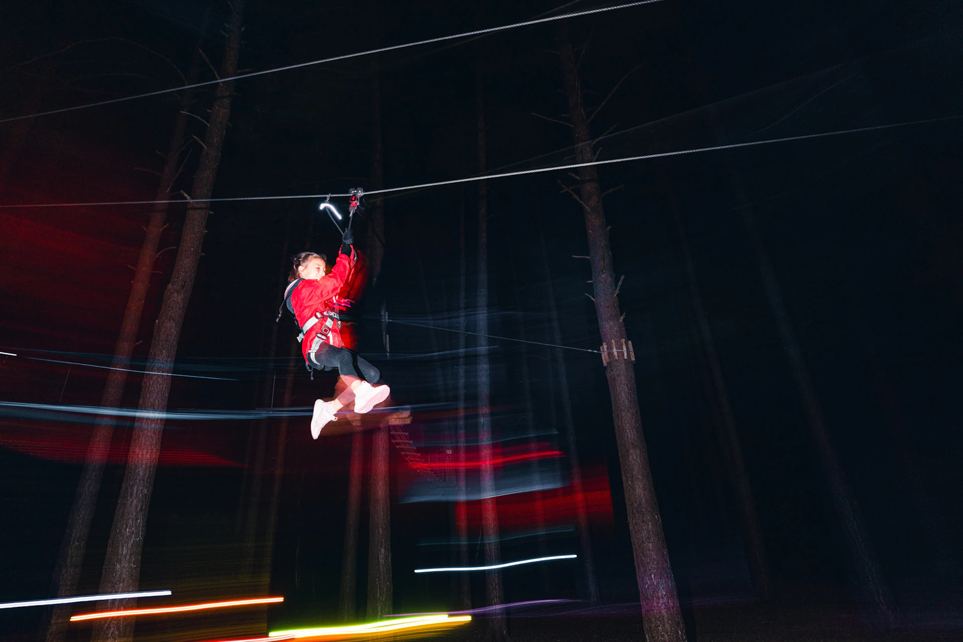 A zip wire ride on Go Ape SUndown Adventure through the forest after dark