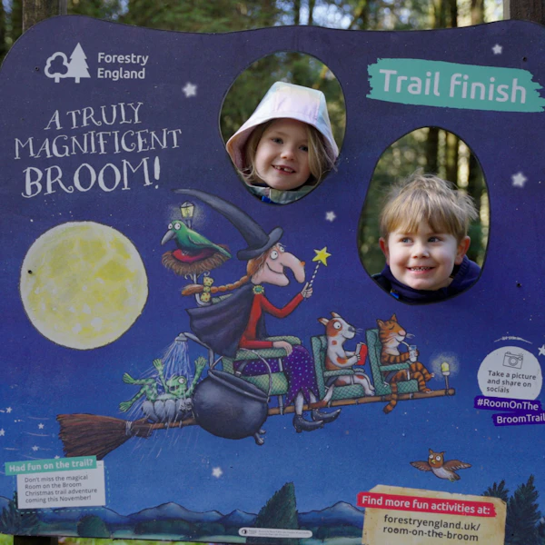 Children pose for a picture in a Room on the Broom cut out
