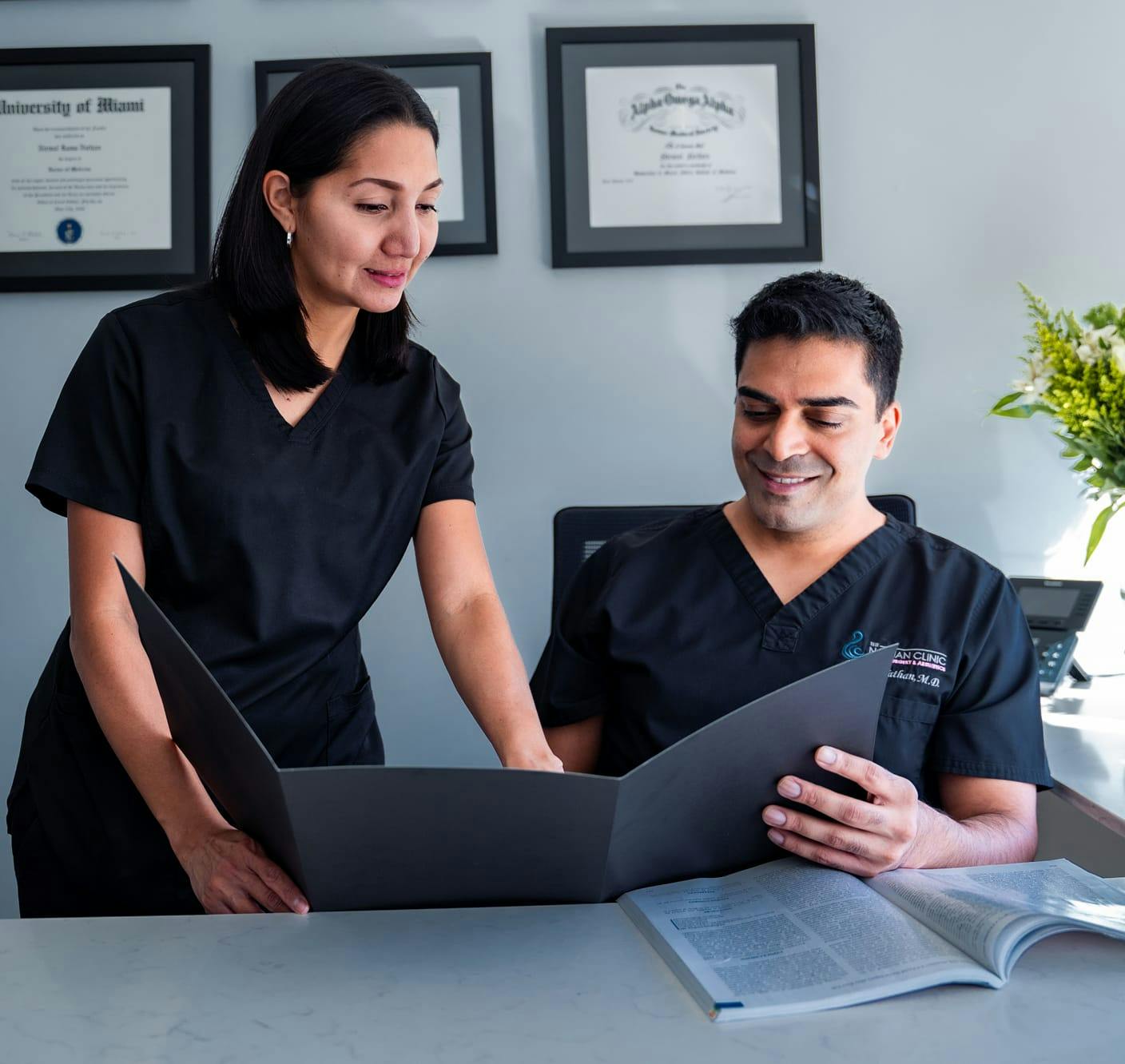 Dr. Nathan working with his staff