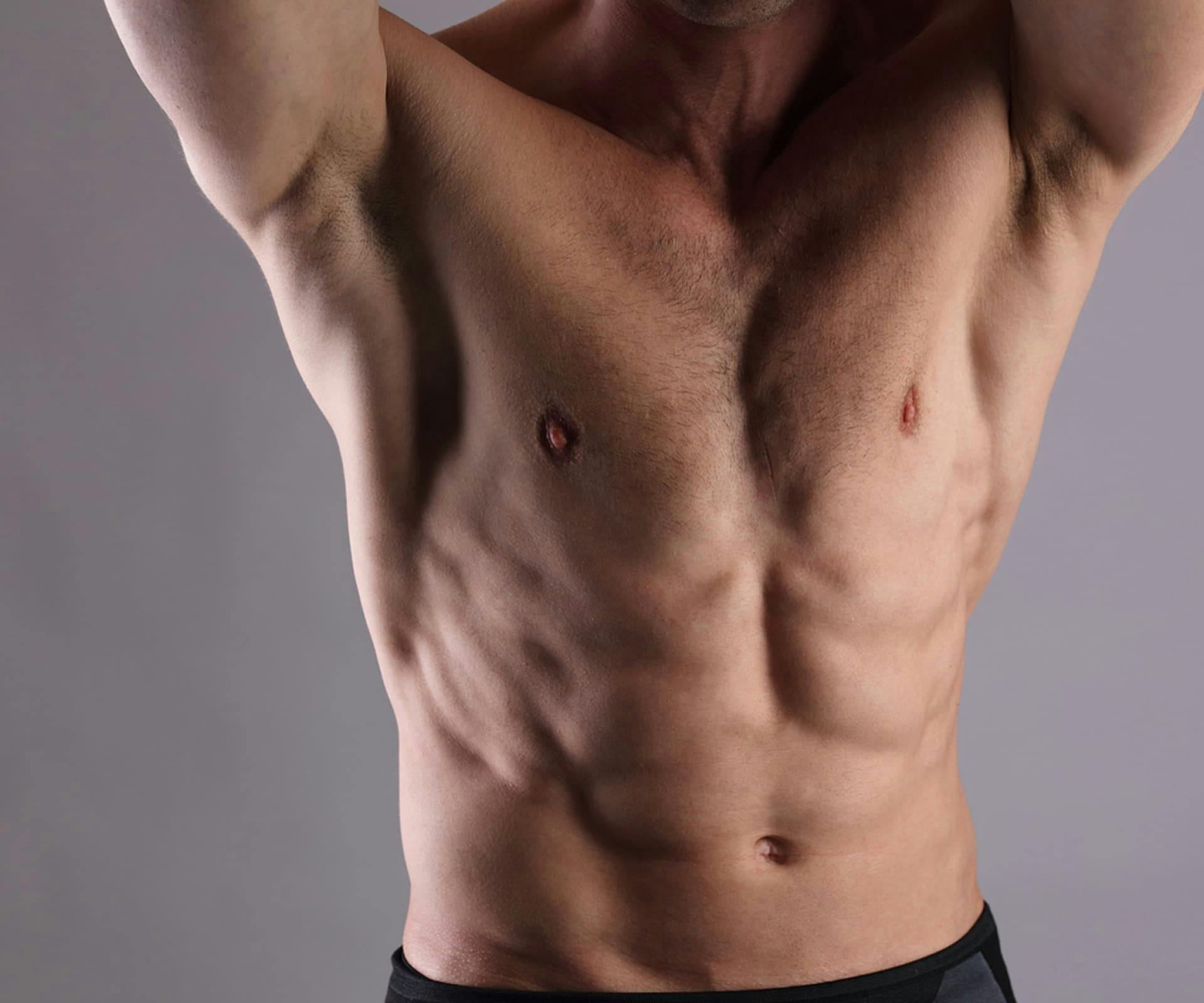 close up on man's pecs and abs