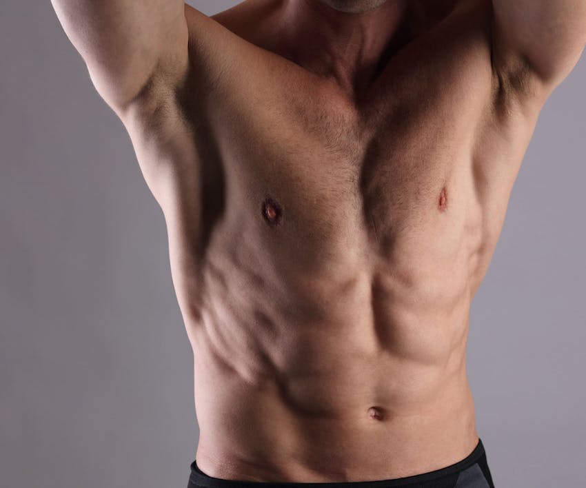 close up on man's pecs and abs