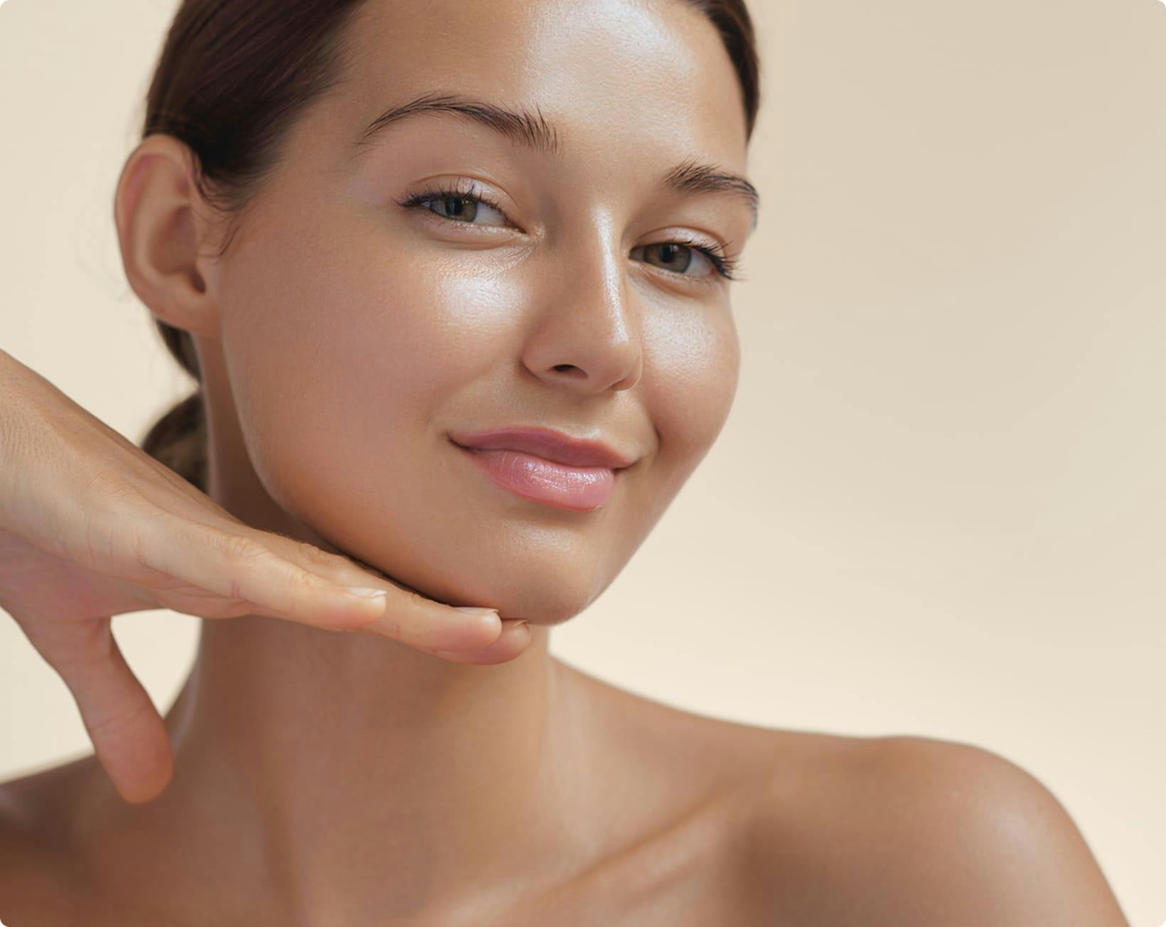 woman holding her hand under her chin