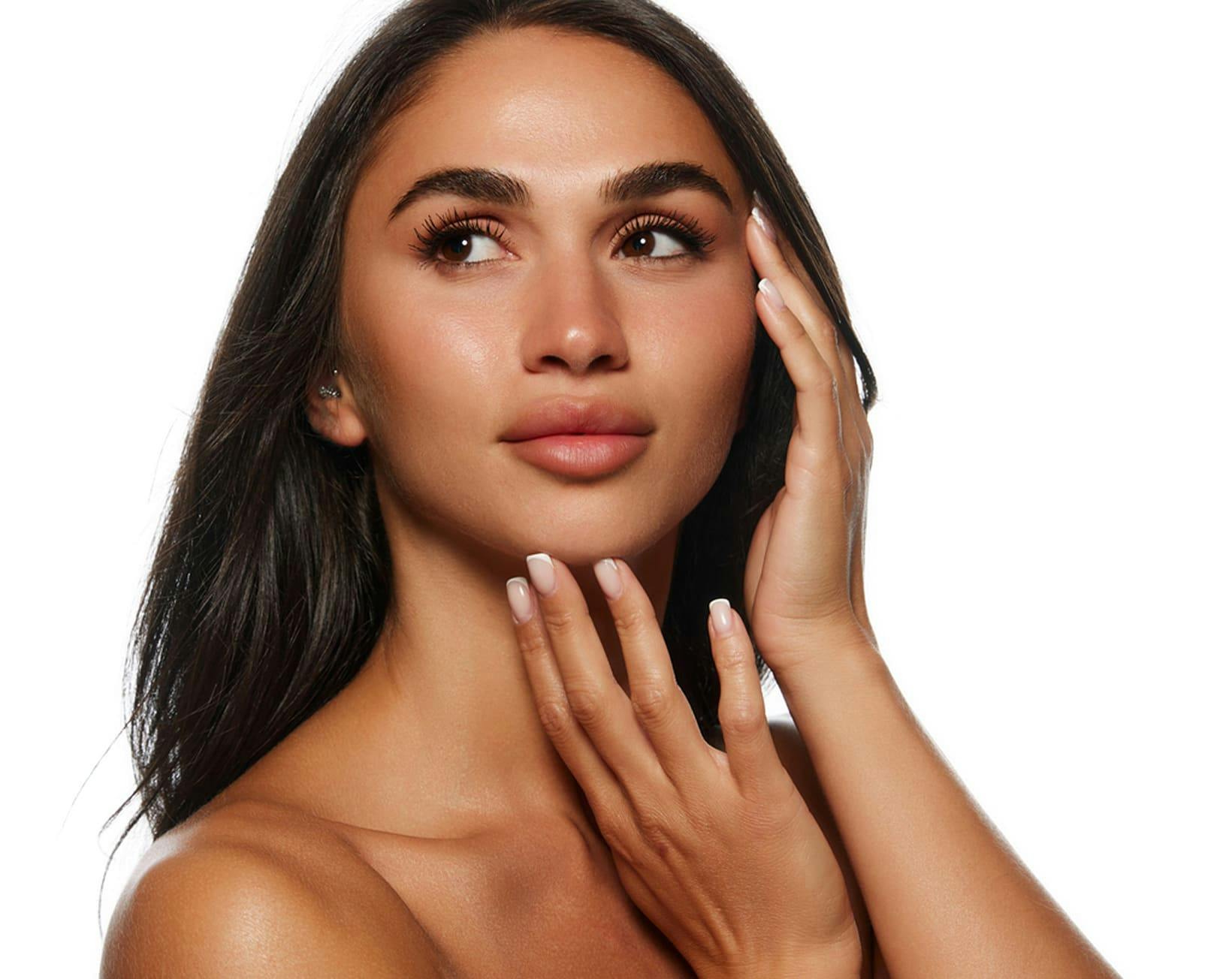 Woman touching chin and smiling