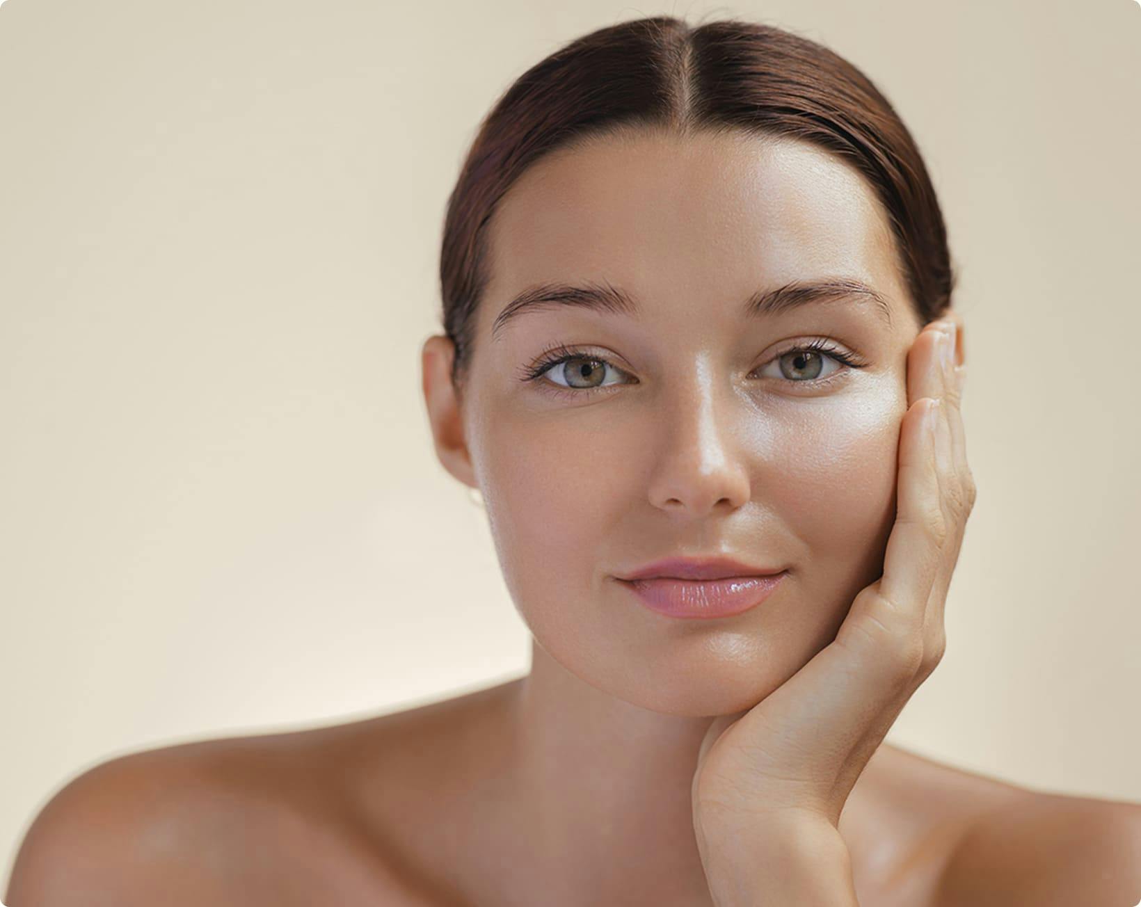Woman resting chin on hand smiling