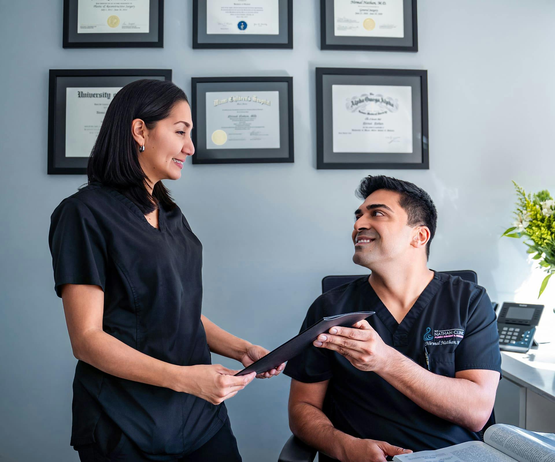 Patient handing doctor clipboard