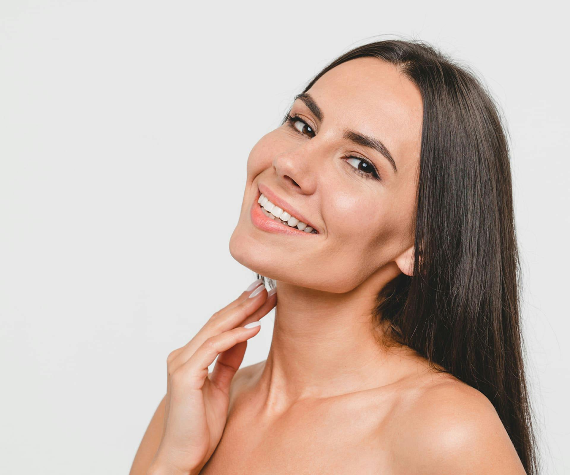 woman smiling and leaning her head back