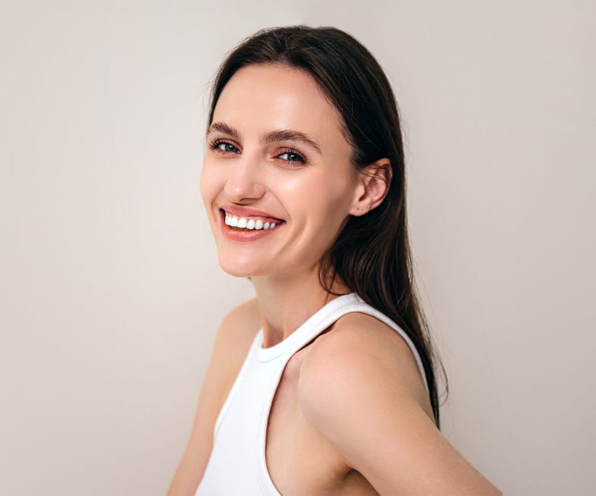 woman smiling over her shoulder