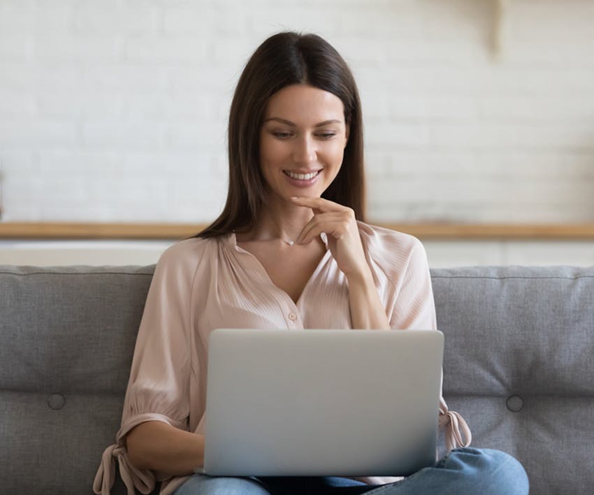 woman looking at a laptop