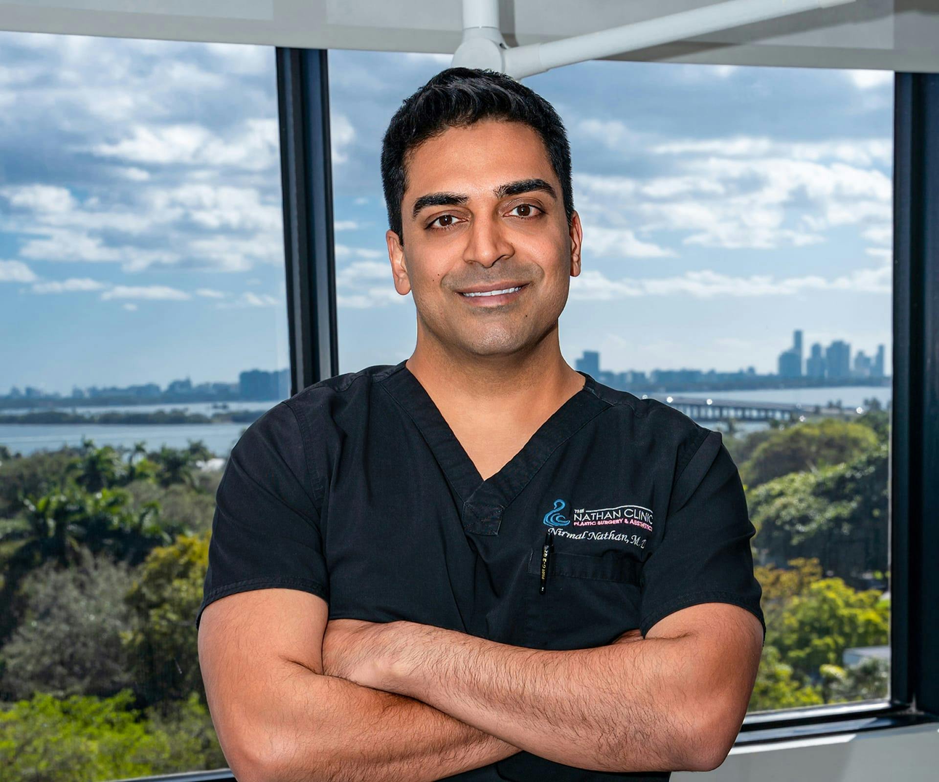 Dr. Nathan crossing his arms