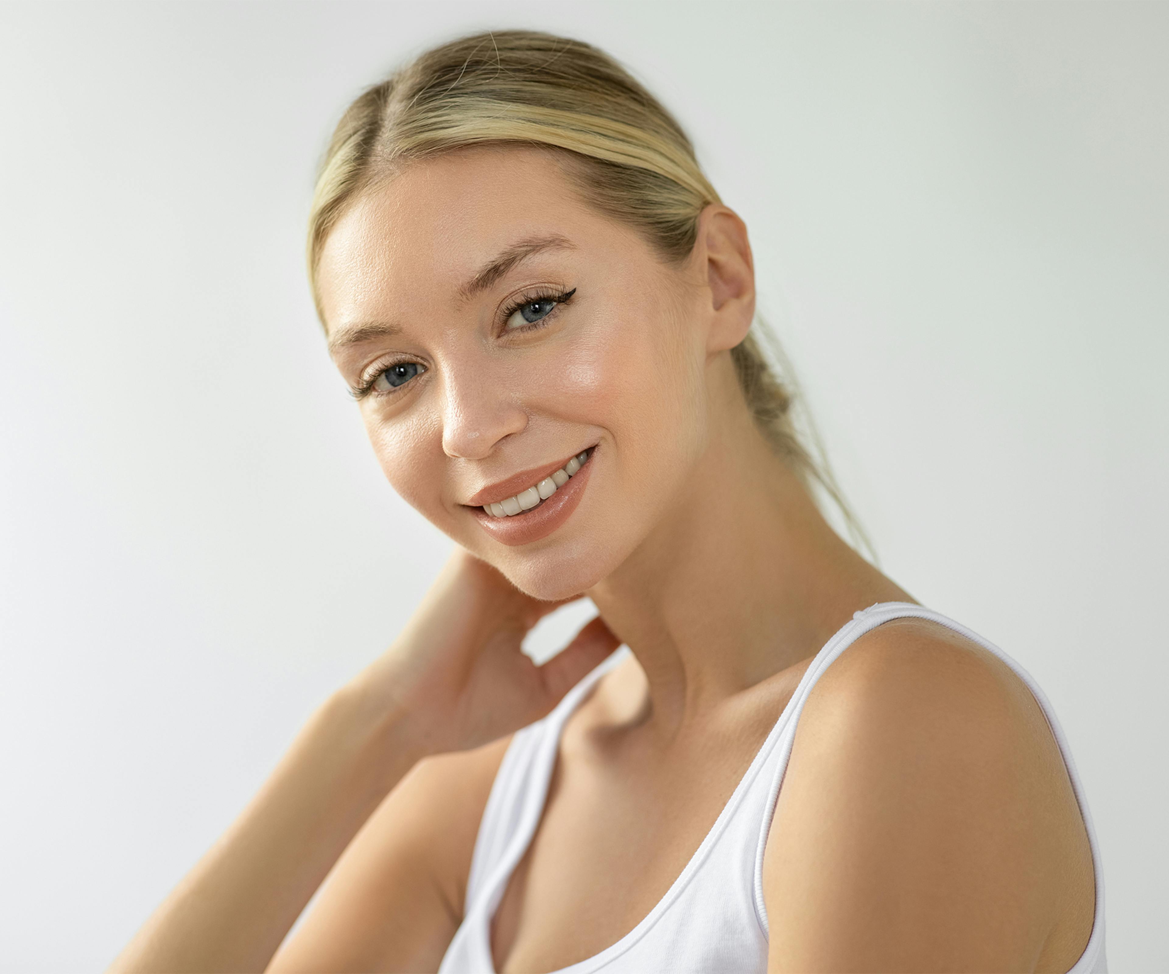 woman with blonde hair in a low ponytail