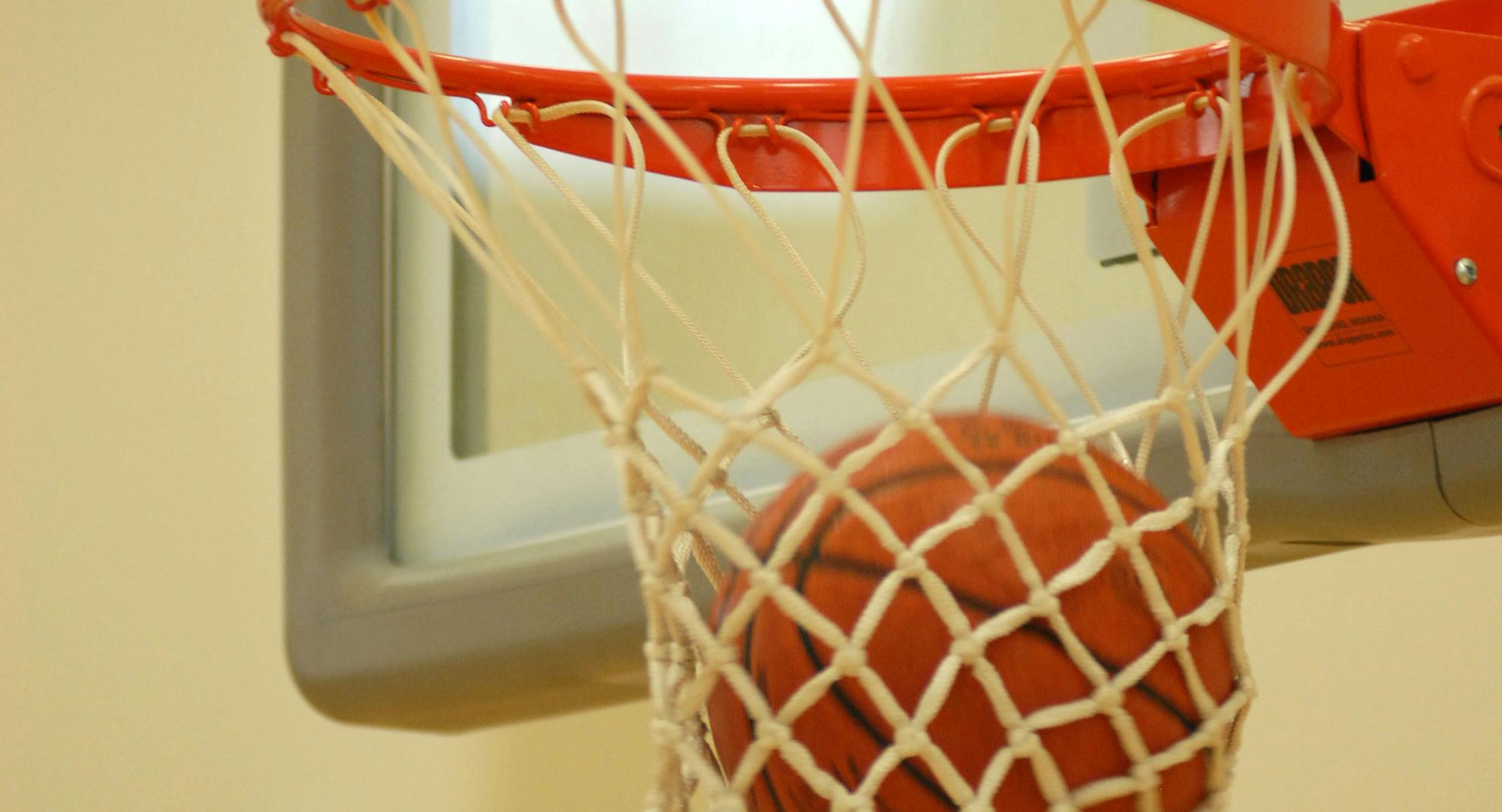 Basketball through hoop