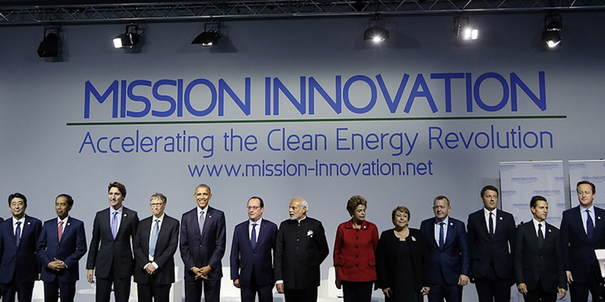 world leaders standing on stage in front of mission innovation banner