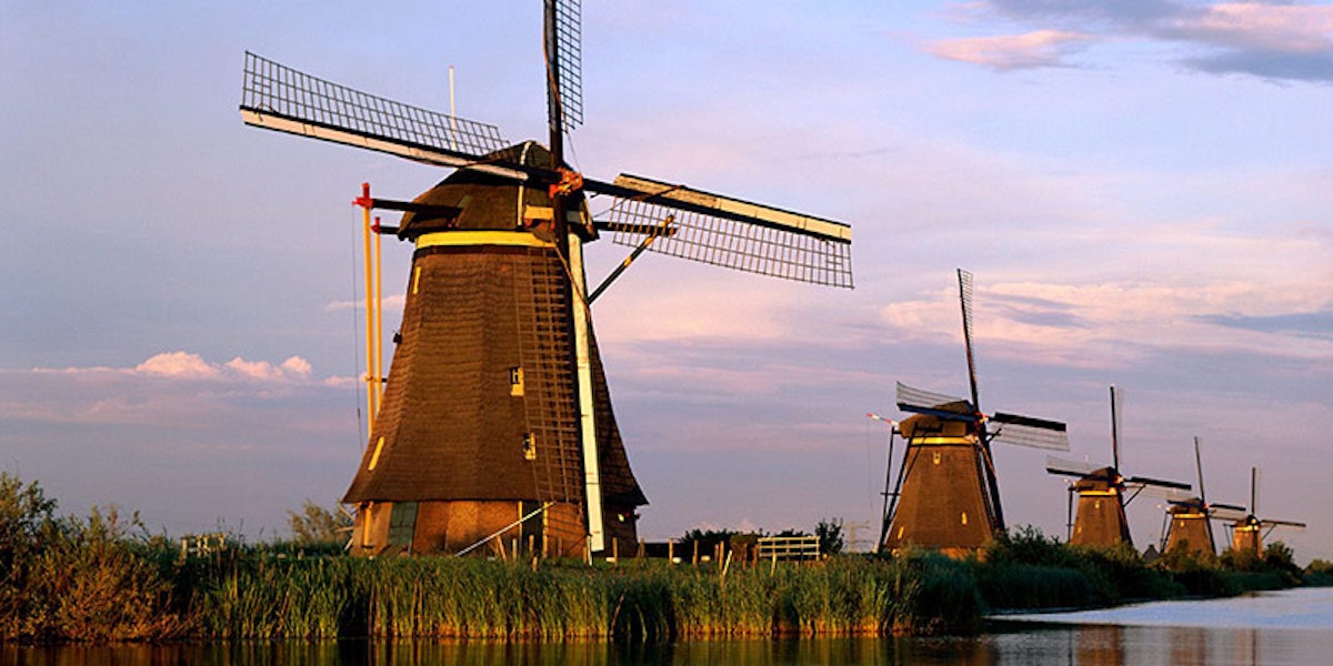 5 windmills on a river in the Netherlands