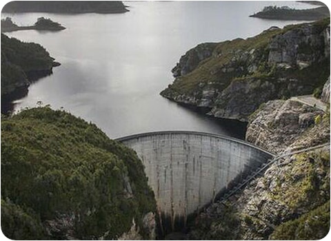 Tasmanian dam wall viewed from elevation on overcast day