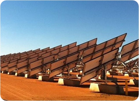 solar farm in Australian outback viewed from behind solar panels