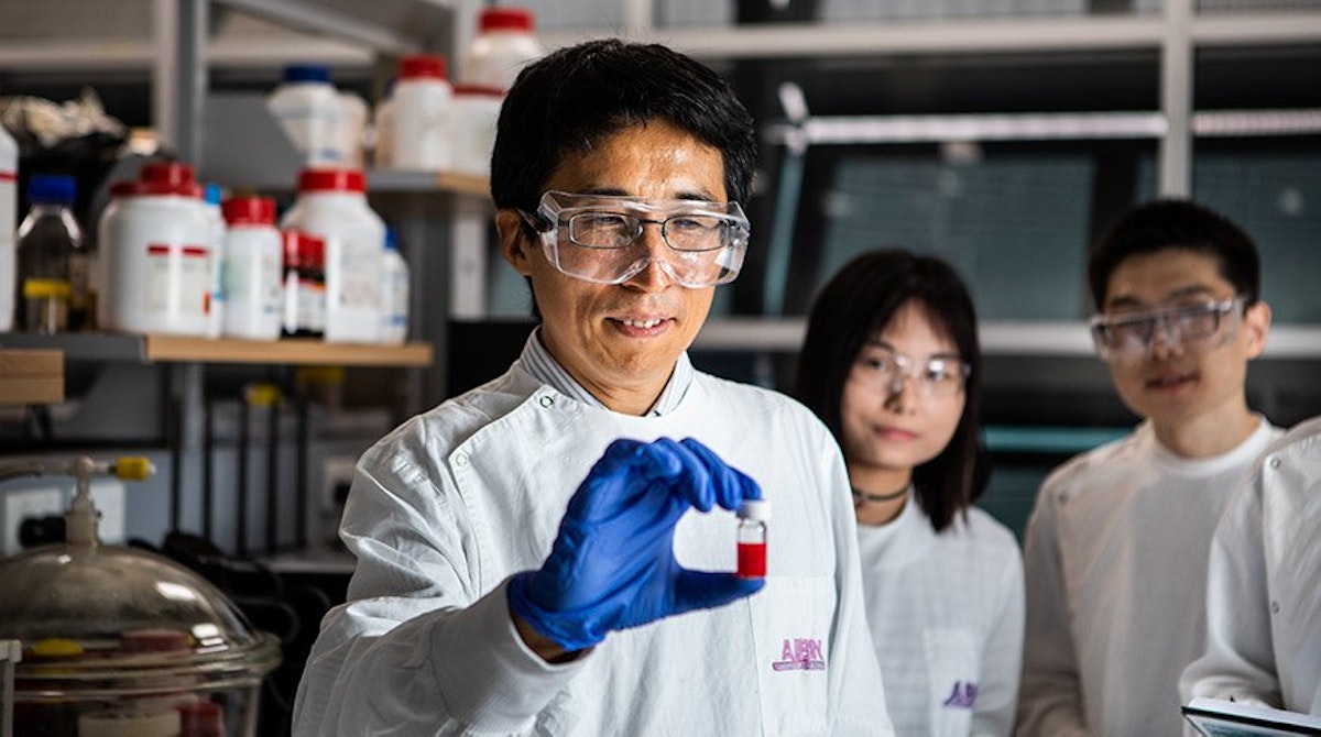 uq quantum dot solar cells held by researcher