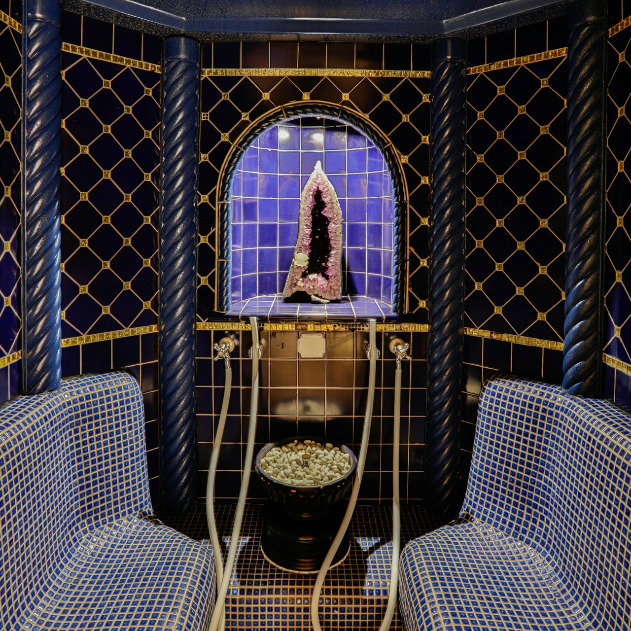 Gemstone grotto in the sauna at the Hotel Ermitage Steam room decorated with tiles and mosaics, an amethyst at the back