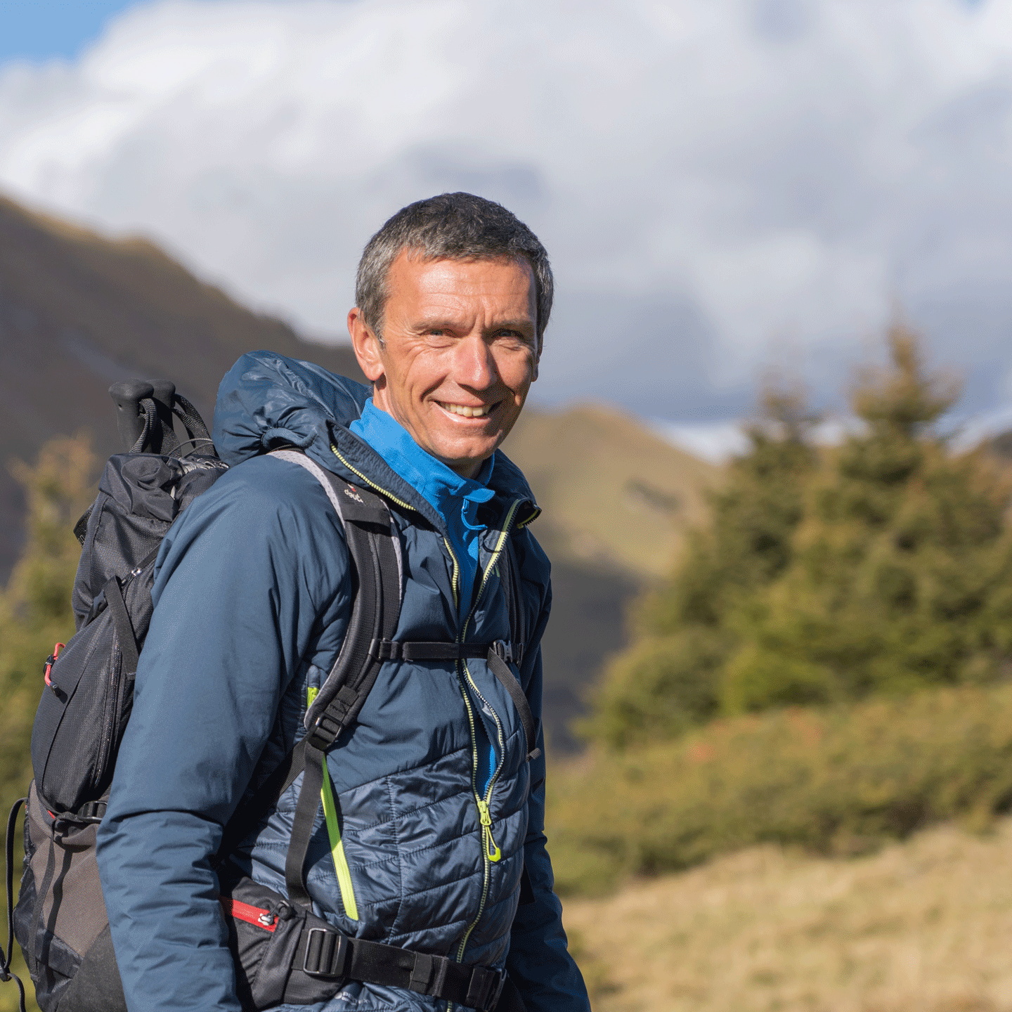 Christian Rudin, Natur-Guide im Hotel Ermitage Lächelnder Mann in Berglandschaft