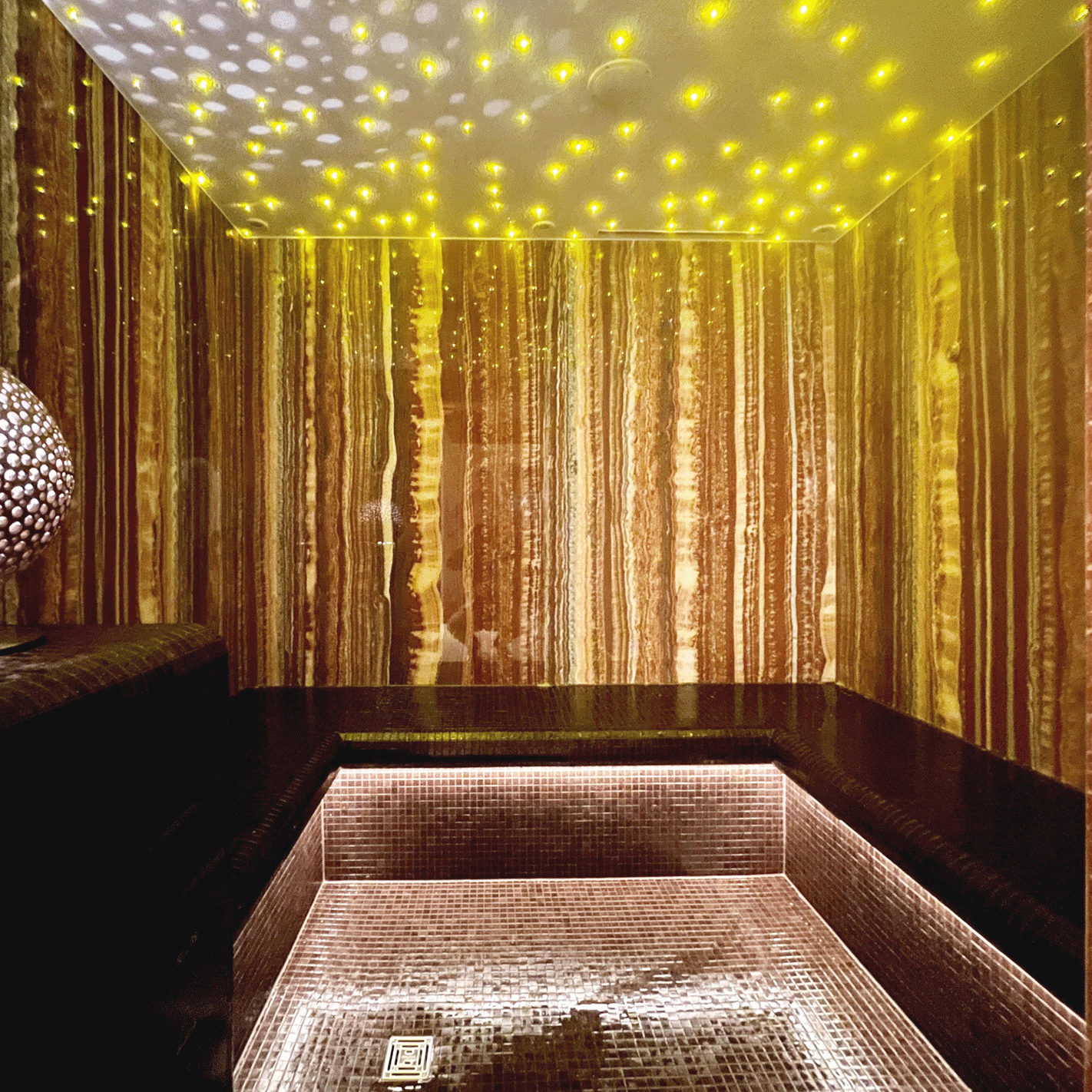Aroma steam bath in the Hotel Ermitage Steam bath with small mosaic tiles and glittering ceiling lighting