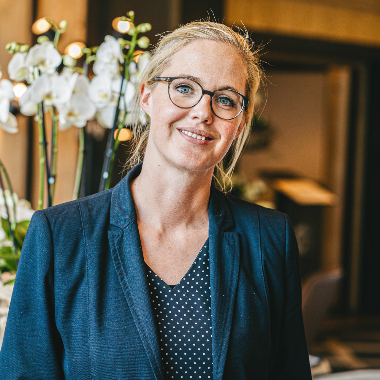 Evelyn Engler, Vice Director of the Hotel Ermitage Woman with glasses smiles into the camera