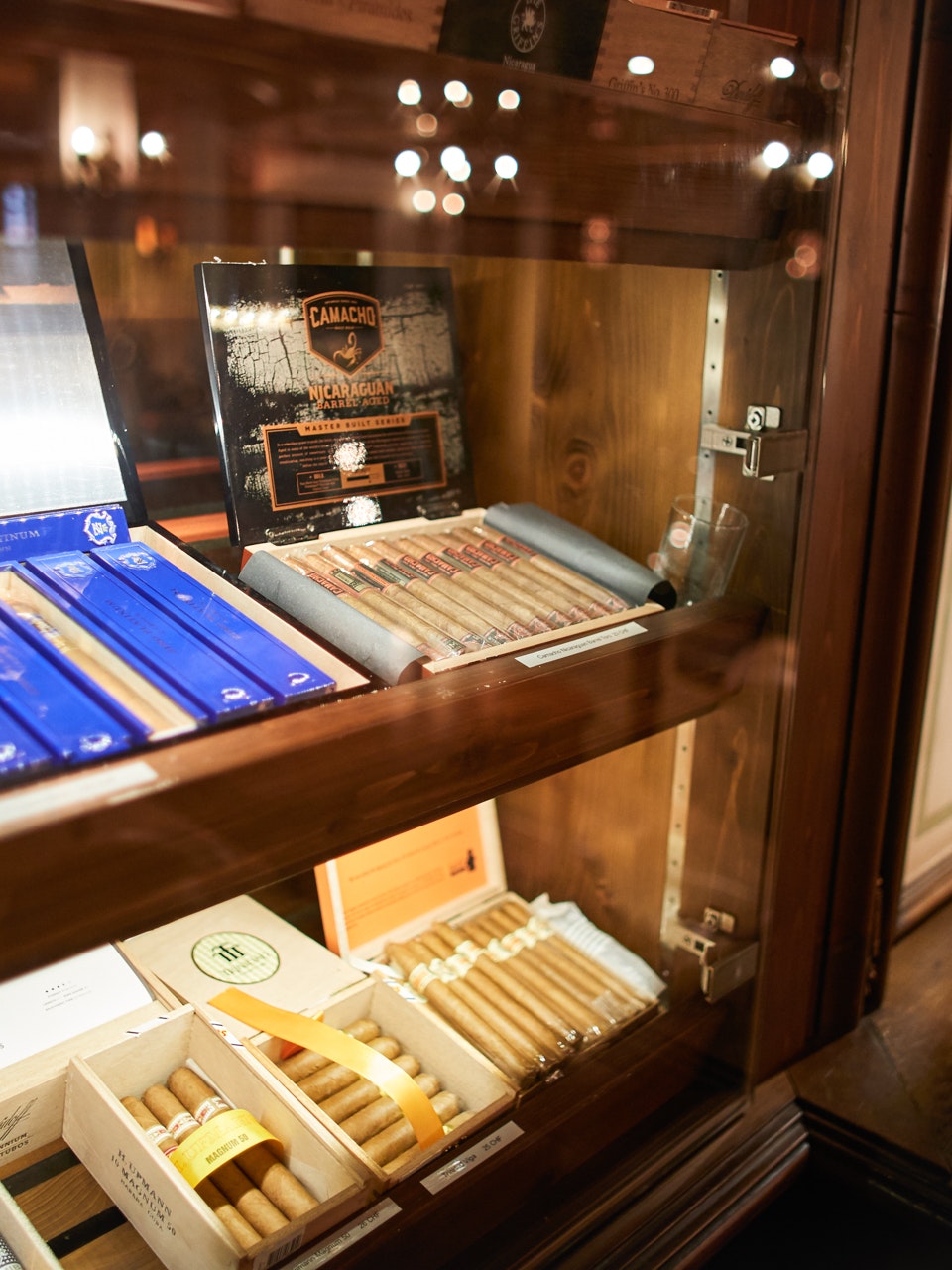 Davidoff smoking parlour in the Hotel Ermitage Cigars in a display in a dark room with leather furniture