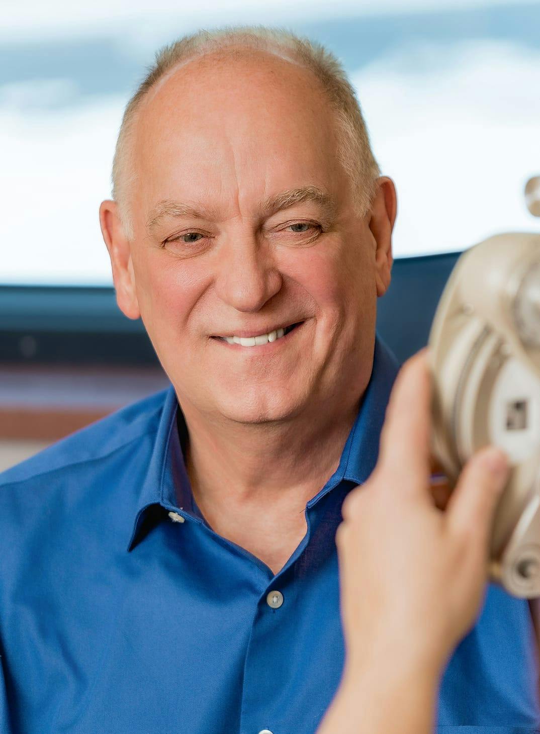 Smiling patient undergoing cataract evaluation