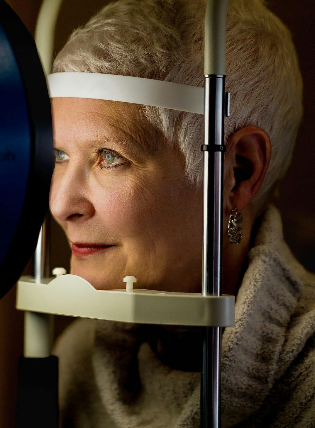 Female patient undergoing comprehensive eye examination