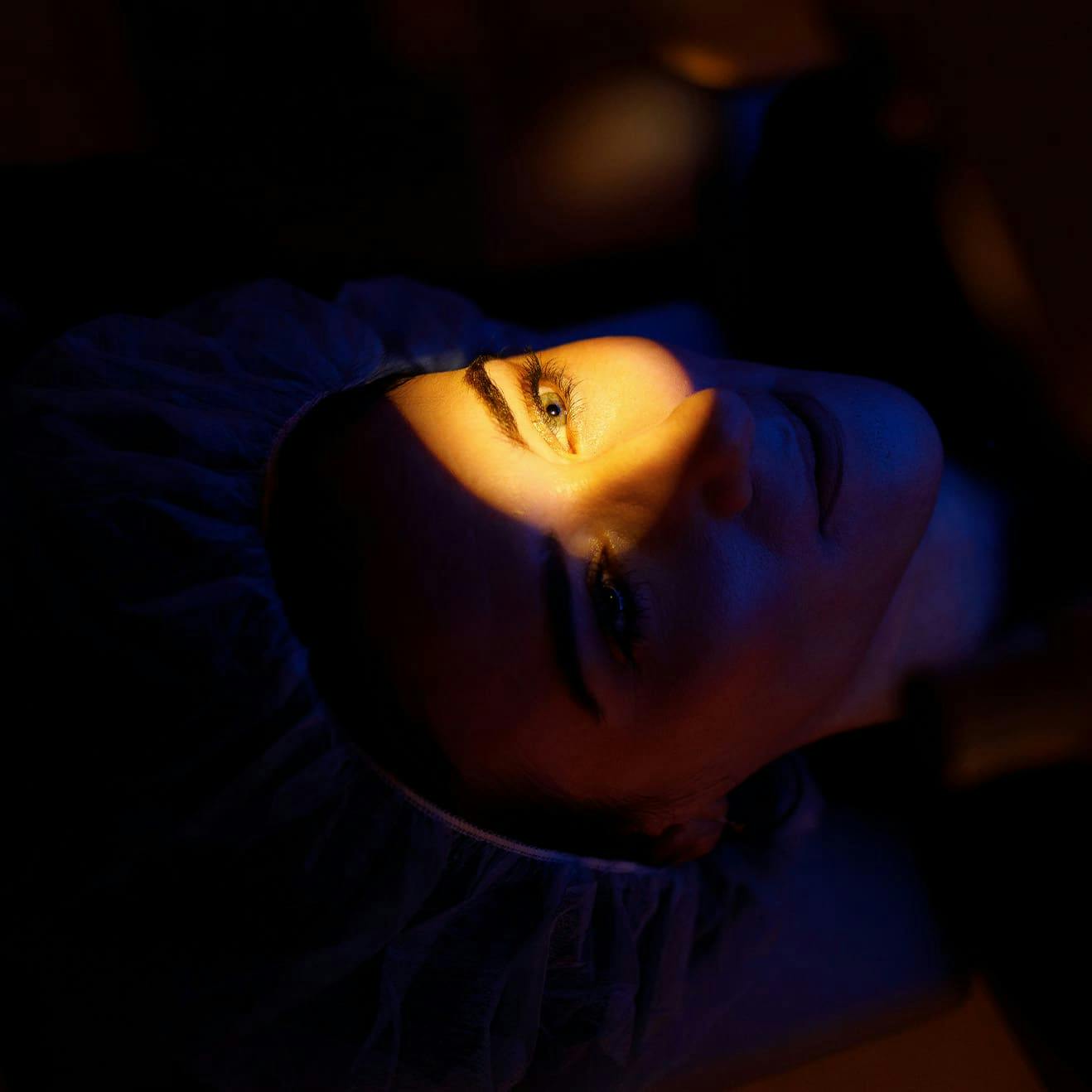 light beamed onto a woman's eye