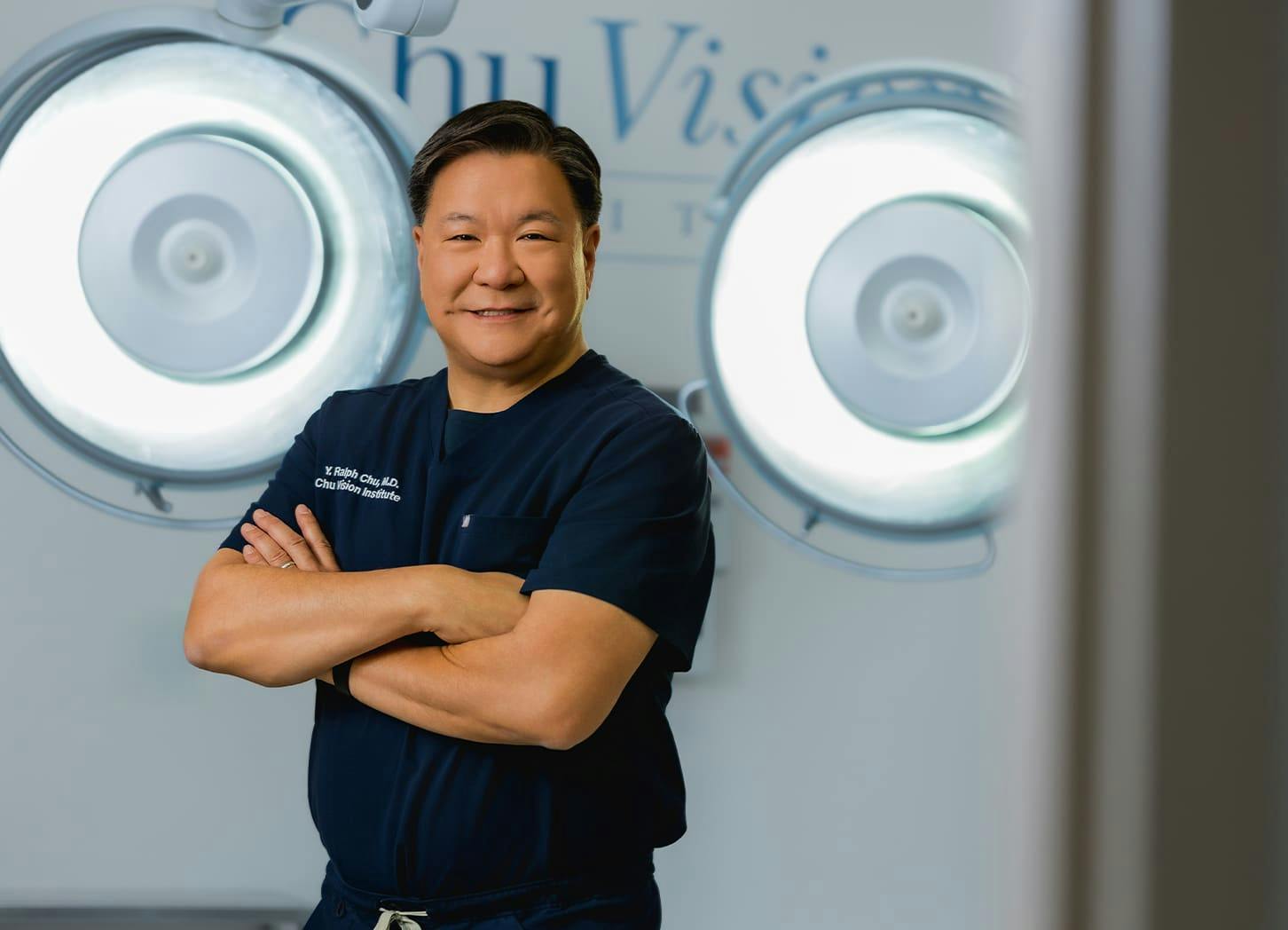 Dr. Chu crossing his arms