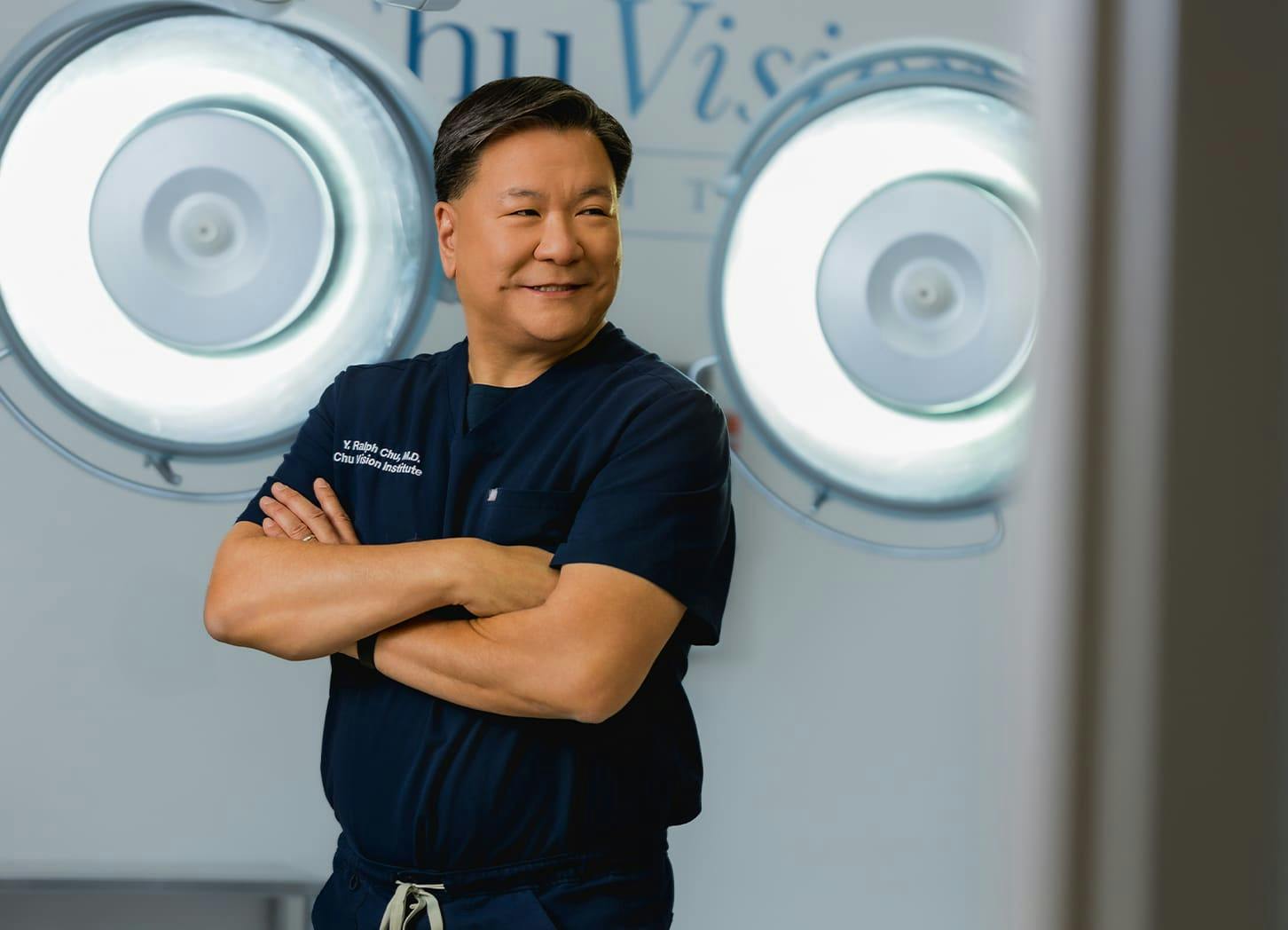 Dr. Chu smiling with his arms crossed