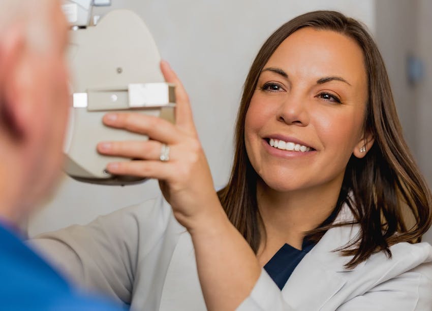 eye doctor smiling at patient
