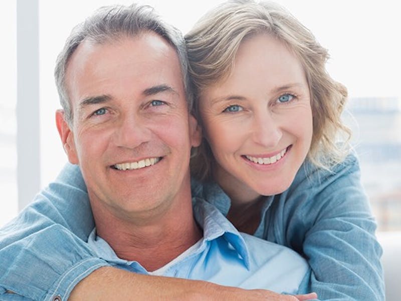 man and woman embracing and smiling
