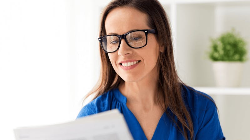 woman wearing glasses and a blue shirt
