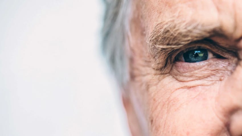 older gentleman with closeup on eye