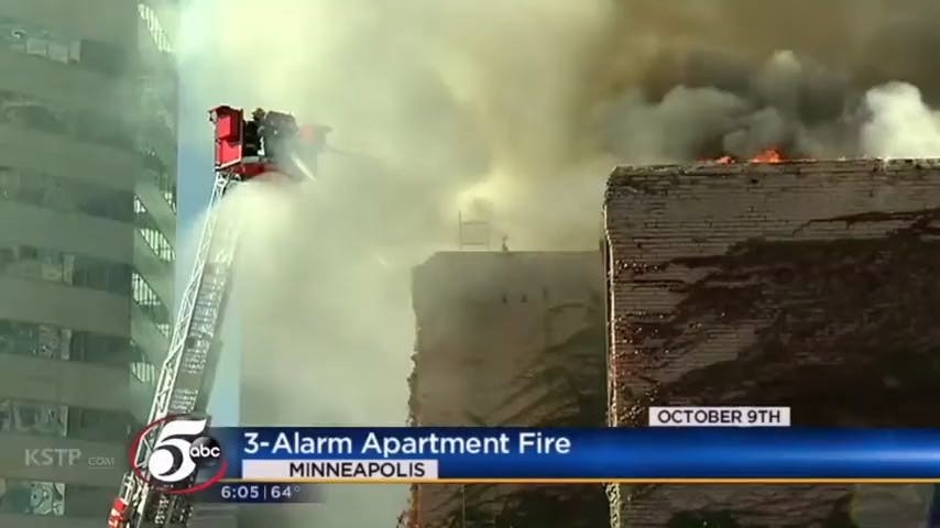 news on building on fire with firefighters saving it