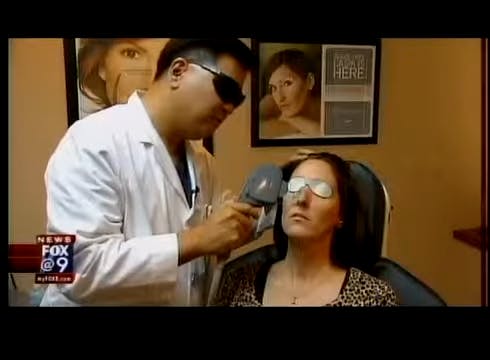 Dr. Chu doing IPL treatment on patient