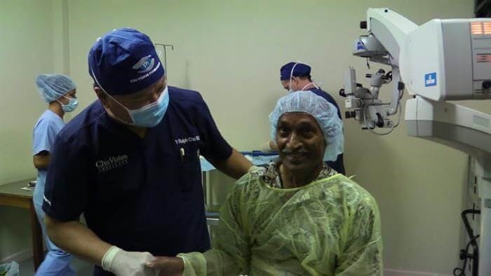 Dr. Chu holding patient's hand after procedure