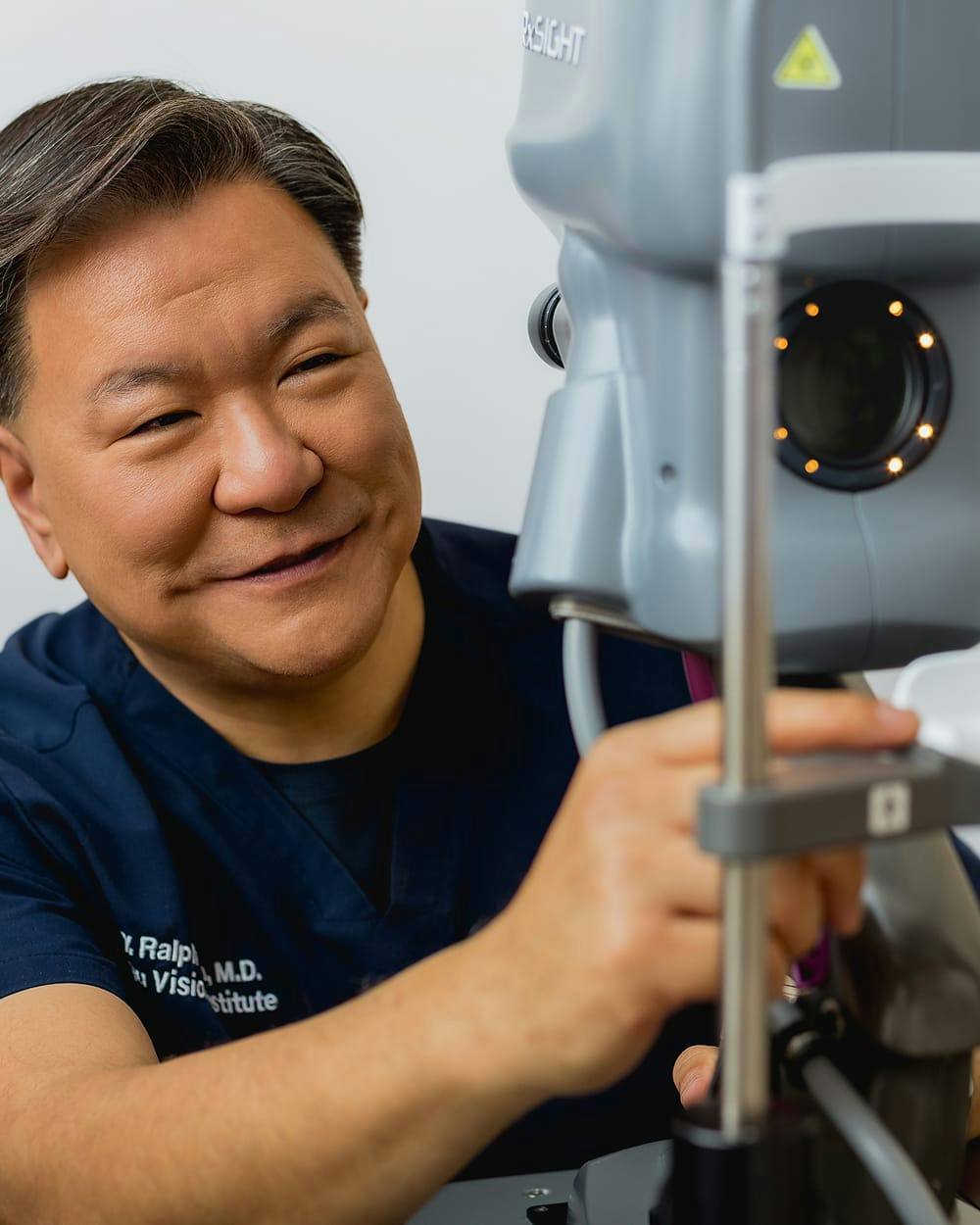 Smiling patient undergoing cataract evaluation