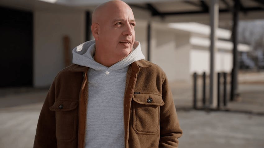 man looking off to the right with hoodie