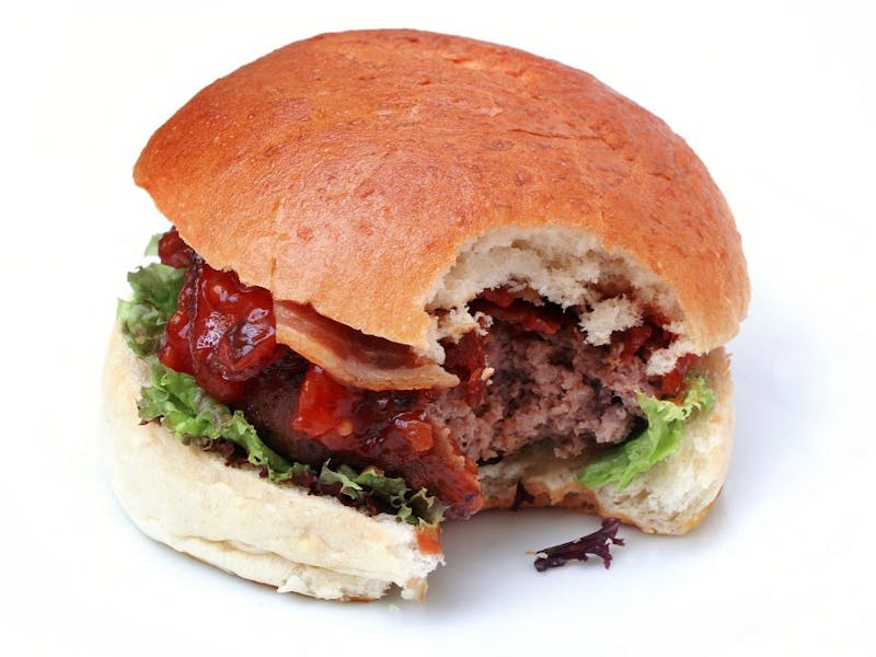 image of a hamburger with a bite taken out of it