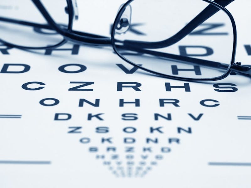 glasses on a table with a chart in the background